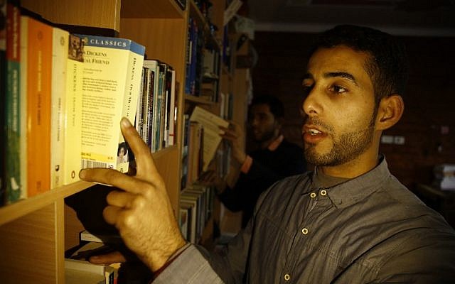 Mossab Abo Toha, who is collecting english books for his "Library and Bookshop for Gaza" project, at the library in his family home in Beit Lahia in northern Gaza on February 20, 2017. (AFP Photo/Mohammed Abed) Mossab Abo Toha, who is collecting english books for his "Library and Bookshop for Gaza" project, at the library in his family home in Beit Lahia in northern Gaza on February 20, 2017. (AFP Photo/Mohammed Abed)