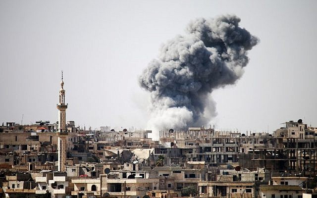 Illustrative. Smoke billows in the distance following reported air strikes on the southern Syrian city of Daraa on February 22, 2017. (Mohamad Abazeed/AFP) Illustrative. Smoke billows in the distance following reported air strikes on the southern Syrian city of Daraa on February 22, 2017. (Mohamad Abazeed/AFP)