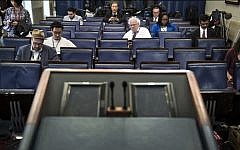 An empty podium is seen as an off camera briefing is held with a small group of reporters and White House Press Secretary Sean Spicer instead of the normal on camera briefing in the White House February 24, 2017 in Washington, DC. (AFP PHOTO / Brendan Smialowski)