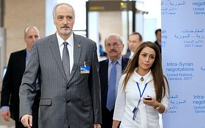 Syrian Ambassador to the UN, Bashar Jaafari (C) arrives for a meeting of Intra-Syria peace talks with UN Special Envoy for Syria at the Palais des Nations in Geneva on February 25, 2017. (AFP Photo/Pool/Pierre Albouy)