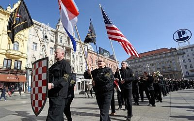 Supporters of a Croatian far-right party carry US and Croatian flags as they march through downtown Zagreb on February 26, 2017, before gathering at the main square. Participants also voiced support for US President Donald Trump. (AFP/STRINGER)