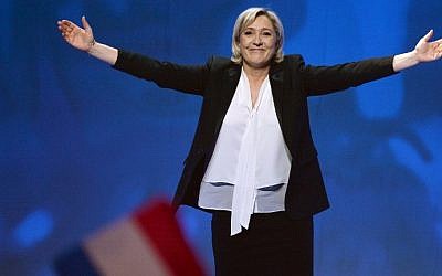 French far-right National Front (FN) party candidate for the presidential election Marine Le Pen waves, as she arrives at a campaign rally at the Zenith de Nantes venue in Saint-Herblain on February 26, 2017.  (AFP Photo/Jean-Francois Monier)