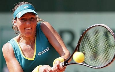 This file photo taken on May 30, 2012 shows Israel's Shahar Peer hitting a return during her Women's Singles 2nd Round tennis match of the French Open tennis tournament at the Roland Garros stadium. (AFP PHOTO / THOMAS COEX)