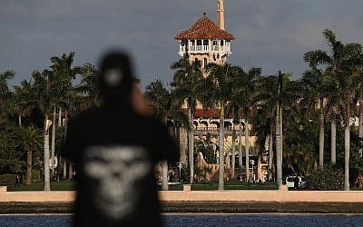 An onlooker takes a photo of the Mar-a-Lago Resort as President Donald Trump is hosts Japanese Prime Minister Shinzo Abe on February 11, 2017 in West Palm Beach, Florida. (Joe Raedle/Getty Images/AFP)