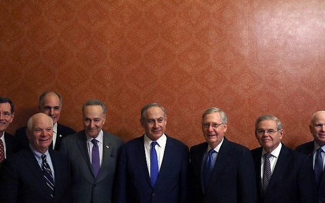 Prime Minister Benjamin Netanyahu (C), stands with members of the U.S. Senate, left to right, John Barrasso (R-WY), Ben Cardin (D-MD), Robert Casey (D-PA), Senate Minority Leader Chuck Schumer (D-NY), Senate Majority Leader Mitch McConnell (R-KY), Bob Menendez (D-NJ) and John McCain (R-AZ), during a meeting at the U.S. Capitol on February 15, 2017 in Washington, DC. (Mark Wilson/Getty Images/AFP)