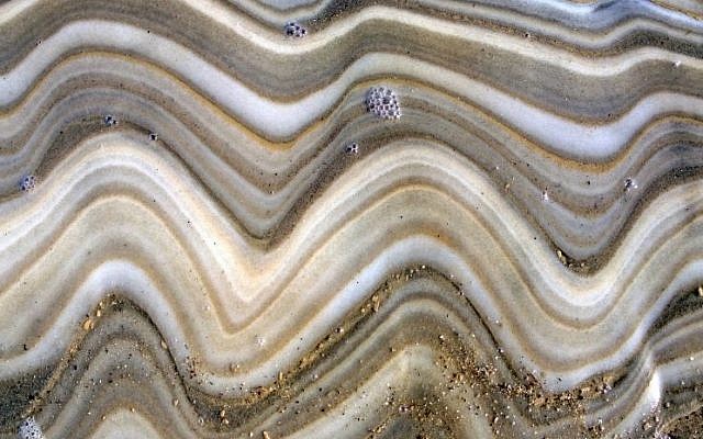 Brilliant colors revealed in the rock surface on the shores of the Dead Sea. (courtesy Noam Bedein)