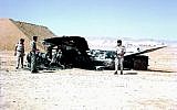 Israeli Air Force officers next to a destroyed Egyptian MiG-21 at Bir Gifgafa. (Yehezkel Rahamim,  Wikimedia)