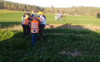 First responders evacuating the wounded at the scene of a car crash in southern Israel in which 18 Palestinians were injured on February 7, 2017. (United Hatzalah spokesperson)