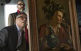 Dr. Clarence Epstein, foreground, director of the Max Stern Art Restitution Project, inspects the back of "Young Man As Bacchus" by Jan Franse Verzijl during a ceremony to formally return the painting to representatives of the Max and Iris Stern Foundation, at the Museum of Jewish Heritage in New York, February 8, 2017. (AP/Mary Altaffer)