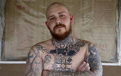 Shane Johnson displays some of his tattoos as he poses in his home in Tippecanoe, Indiana, Thursday, Jan. 12, 2017. (AP Photo/Michael Conroy)