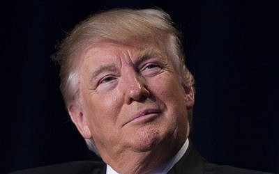 President Donald Trump listens as he is introduced during the National Prayer Breakfast, Thursday, Feb. 2, 2017, in Washington. (AP Photo/Evan Vucci)