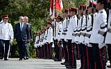 Prime Minister Benjamin Netanyahu inspects an honor guard with Singapore's Prime Minister Lee Kuan Yew at Istana presidential palace on Monday, February 20, 2017 (Haim Zach/GPO)