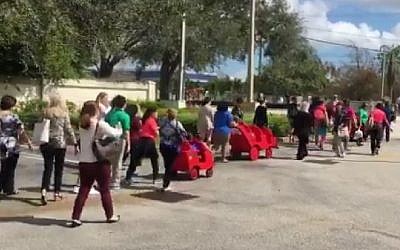 Children and staff heading back to a Jewish school in Davie, Florida, on February 27, 2017 after police gave the all-clear following a hoax bomb threat. (screen capture: Erica Rakow/Twitter)