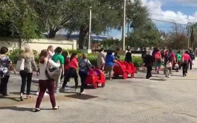 Children and staff heading back to a Jewish school in Davie, Florida, on February 27, 2017 after police gave the all-clear following a hoax bomb threat. (screen capture: Erica Rakow/Twitter) Children and staff heading back to a Jewish school in Davie, Florida, on February 27, 2017 after police gave the all-clear following a hoax bomb threat. (screen capture: Erica Rakow/Twitter)