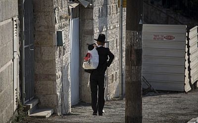 An ultra-Orthodox man seen walking in the Kiryat Yovel neighborhood in Jerusalem, on August 19, 2014. (Hadas Parush/Flash90) An ultra-Orthodox man seen walking in the Kiryat Yovel neighborhood in Jerusalem, on August 19, 2014. (Hadas Parush/Flash90)