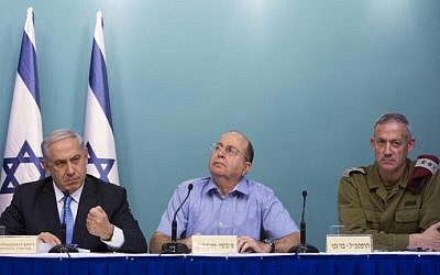 From left, Prime Minister Benjamin Netanyahu, former defense minister Moshe Ya'alon and former IDF chief of staff Benny Gantz speak at a press conference at the Prime Minister Office, following Operation Protective Edge, on August 27, 2014. (Yonatan Sindel/Flash90)
