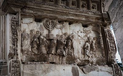 A depiction of Jewish captives and the gold menorah taken from Jerusalem following the destruction of the city in 70 CE, seen on the Arch of Titus, in Rome, Italy, October 20, 2016. (Yossi Zamir/Flash90)