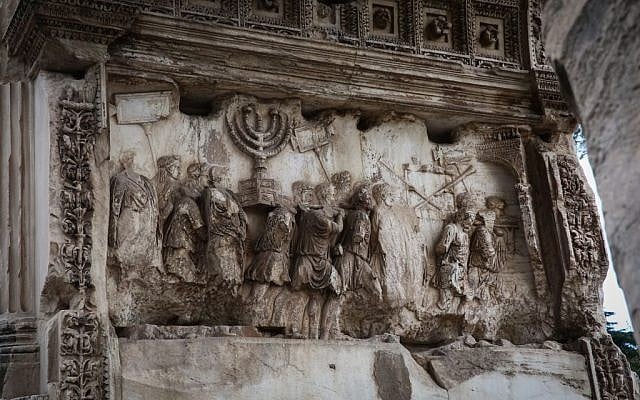 A depiction of Jewish captives and the gold menorah taken from Jerusalem following the destruction of the city in 70 CE, seen on the Arch of Titus, in Rome, Italy, October 20, 2016. (Yossi Zamir/Flash90) A depiction of Jewish captives and the gold menorah taken from Jerusalem following the destruction of the city in 70 CE, seen on the Arch of Titus, in Rome, Italy, October 20, 2016. (Yossi Zamir/Flash90)