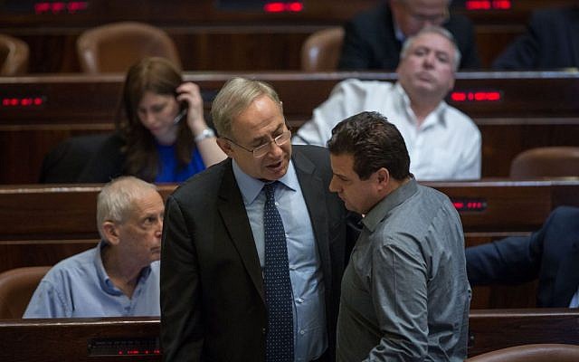 Prime Minister Benjamin Netanyahu and Joint (Arab) List chairman Aiman Odeh talk during a vote on the Regulation Bill in the Knesset on December 7, 2016. (Hadas Parush/Flash90) Prime Minister Benjamin Netanyahu and Joint (Arab) List chairman Aiman Odeh talk during a vote on the Regulation Bill in the Knesset on December 7, 2016. (Hadas Parush/Flash90)