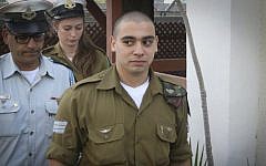IDF Sgt. Elor Azaria arrives for a  court hearing at the Kirya military base in Tel Aviv, on January 24, 2017. (Flash90)