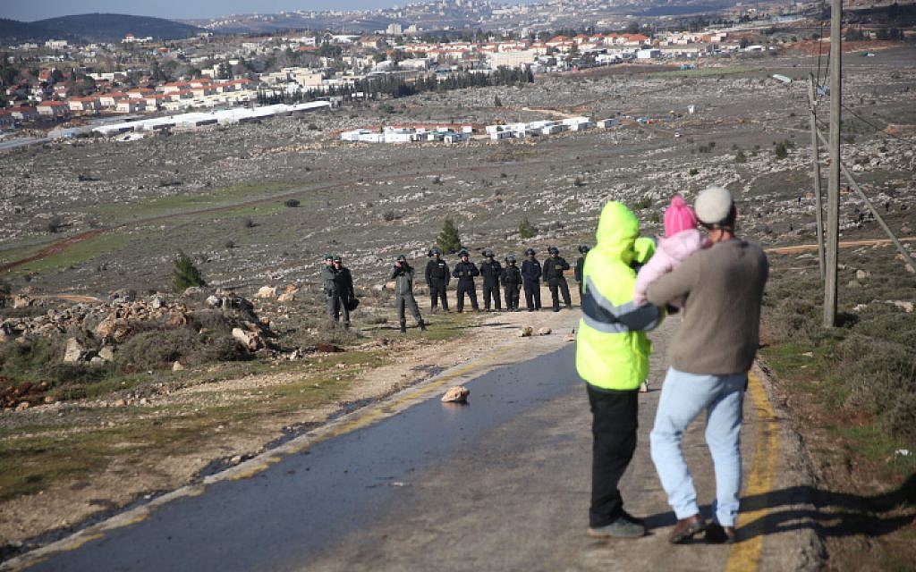Israeli security forces gather ahead of the evacuation of the illegal outpost of Amona, on February 1, 2017. (Hadas Parush/Flash90) Israeli security forces gather ahead of the evacuation of the illegal outpost of Amona, on February 1, 2017. (Hadas Parush/Flash90)