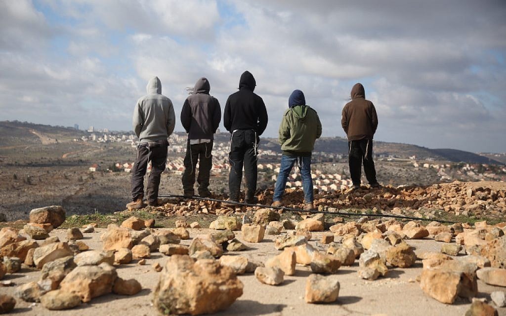 People gather in Amona ahead of the evacuation of the illegal outpost on February 1, 2017. (Hadas Parush/Flash90) People gather in Amona ahead of the evacuation of the illegal outpost on February 1, 2017. (Hadas Parush/Flash90)