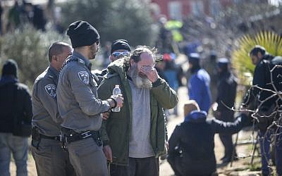 An Israeli settler reacts during evacuation of the illegal outpost of Amona, on the second day into the eviction on February 2, 2017. (Yonatan Sindel/Flash90) An Israeli settler reacts during evacuation of the illegal outpost of Amona, on the second day into the eviction on February 2, 2017. (Yonatan Sindel/Flash90)