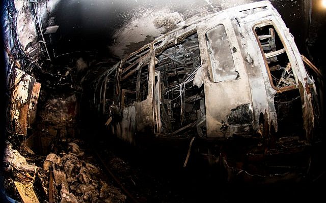 Firefighters attend the scene of a fire in the Carmelit underground train Haifa, Northern Israel. February 04, 2017. (Photo by Basel Awidat/FLASH90) Firefighters attend the scene of a fire in the Carmelit underground train Haifa, Northern Israel. February 04, 2017. (Photo by Basel Awidat/FLASH90)
