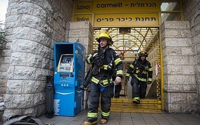 Firefighters attend the scene of a fire in the Carmelit underground train in Haifa on February 4, 2017. (Photo by Basel Awidat/FLASH90) Firefighters attend the scene of a fire in the Carmelit underground train in Haifa on February 4, 2017. (Photo by Basel Awidat/FLASH90)