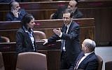 Jewish Home party leader and Education Minister Naftali Bennett, right, party colleague and Justice Minister Ayelet Shaked, left, and opposition leader MK Isaac Herzog (Zionist Union) in the Knesset just prior to the passage of the Regulation Law that retroactively legalizes West Bank settlement homes built on private Palestinian property. (Yonatan Sindel/Flash90)