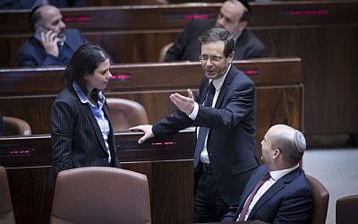 Jewish Home party leader Naftali Bennett (right), party colleague and Minister of Justice Ayelet Shaked and leader of the opposition Isaac Herzog seen in the Knesset just prior to the passage of the Regulation Law, which retroactively legalizes outposts built in the West Bank. (Yonatan Sindel/Flash90) Jewish Home party leader Naftali Bennett (right), party colleague and Minister of Justice Ayelet Shaked and leader of the opposition Isaac Herzog seen in the Knesset just prior to the passage of the Regulation Law, which retroactively legalizes outposts built in the West Bank. (Yonatan Sindel/Flash90)