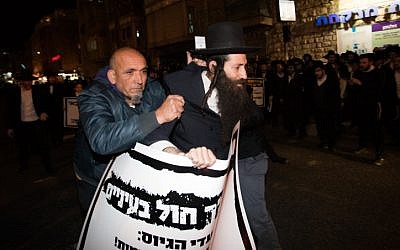 Ultra-Orthodox demonstrators during a protest against the jailing of Jewish seminary student who failed to comply with an army recruitment order, in Jerusalem's Mea Shearim neighborhood, February 7, 2017. (Yonatan Sindel/Flash90)
