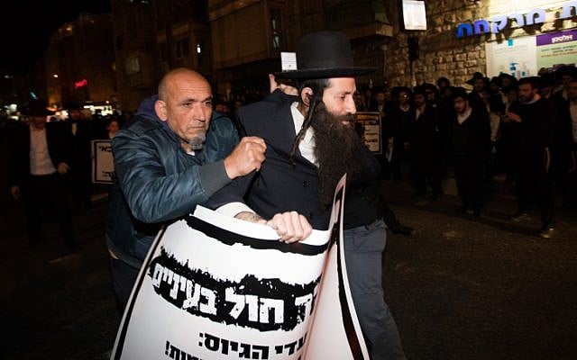 Ultra-Orthodox demonstrators during a protest against the jailing of Jewish seminary student who failed to comply with an army recruitment order, in Jerusalem's Mea Shearim neighborhood, February 7, 2017. (Yonatan Sindel/Flash90) Ultra-Orthodox demonstrators during a protest against the jailing of Jewish seminary student who failed to comply with an army recruitment order, in Jerusalem's Mea Shearim neighborhood, February 7, 2017. (Yonatan Sindel/Flash90)