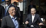 Prime Minister Benjamin Netanyahu and Finance Minister Moshe Kahlon sit for a lunch break at Hummus Ben Sira in Central Jerusalem, February 8, 2017. (Noam Revkin Fenton/Flash90)