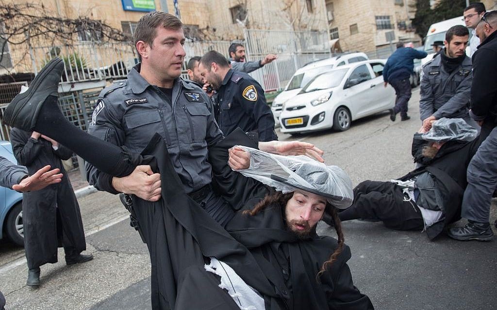 Ultra-Orthodox men clash with police during a protest against the arrest of a yeshiva student who failed to comply with a recruitment order, outside an IDF recruiting office in Jerusalem on February 13, 2017. (Photo by Noam Revkin Fenton/Flash90) Ultra-Orthodox men clash with police during a protest against the arrest of a yeshiva student who failed to comply with a recruitment order, outside an IDF recruiting office in Jerusalem on February 13, 2017. (Photo by Noam Revkin Fenton/Flash90)