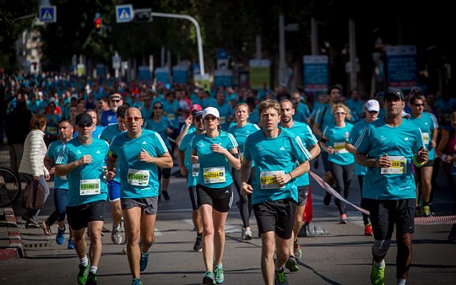 Illustrative: Runners take part in a marathon in Israel's coastal city of Tel Aviv on February 24, 2017. (Miriam Alster/Flash90) Illustrative: Runners take part in a marathon in Israel's coastal city of Tel Aviv on February 24, 2017. (Miriam Alster/Flash90)