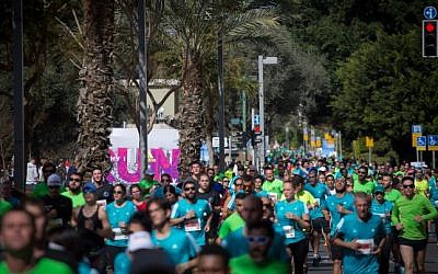 Illustrative: Runners take part in a marathon in Israel's coastal city of Tel Aviv on February 24, 2017. (Miriam Alster/Flash 90)