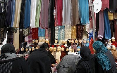 Women look at veils on display at an exhibition hall for the Muslim World Fair in Le Bourget, outside Paris, Dec.17, 2011. (AP Photo/Christophe Ena) Women look at veils on display at an exhibition hall for the Muslim World Fair in Le Bourget, outside Paris, Dec.17, 2011. (AP Photo/Christophe Ena)