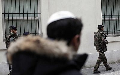 French soldiers patrol next to a Jewish school, in Paris. Jan. 13, 2015. (AP Photo/Thibault Camus)