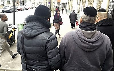 Members of French Jewish community walk in a street of Paris, Wednesday, Feb. 22, 2017. (AP Photo/Jeffrey Schaeffer) Members of French Jewish community walk in a street of Paris, Wednesday, Feb. 22, 2017. (AP Photo/Jeffrey Schaeffer)
