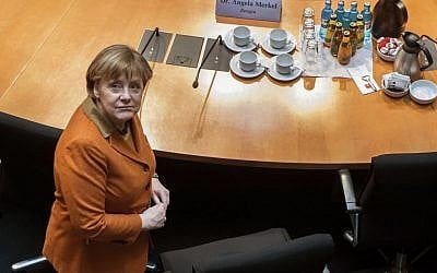 German Chancellor Angela Merkel waits for the beginning of a questioning at an investigation committee of the German federal parliament looking into alleged US surveillance in Germany and the activities of Germany's own foreign intelligence service in Berlin, Germany, Thursday, Feb. 16, 2017. (Bernd von Jutrczenka/dpa via AP)