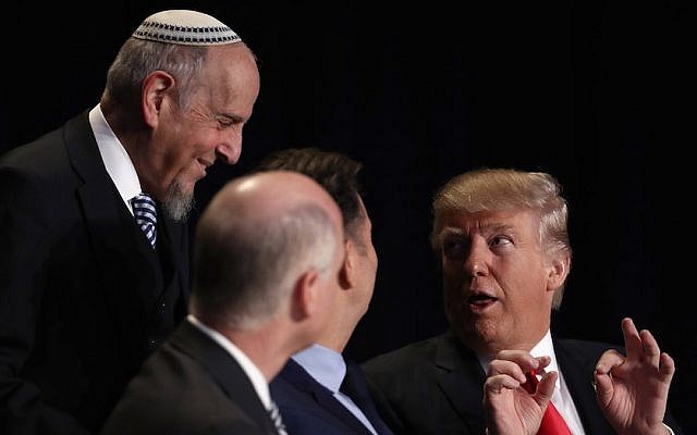 US President Donald Trump speaks with members of the head table at the National Prayer Breakfast February 2, 2017 in Washington, DC. (Win McNamee/Getty Images) US President Donald Trump speaks with members of the head table at the National Prayer Breakfast February 2, 2017 in Washington, DC. (Win McNamee/Getty Images)