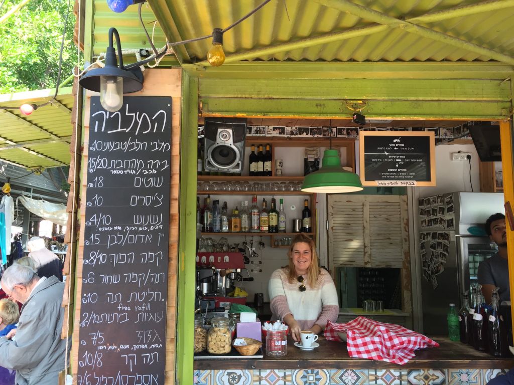 Serving up dishes of malabi and shots of coffee at HaMalabiya (Jessica Steinberg/Times of Israel) Serving up dishes of malabi and shots of coffee at HaMalabiya (Jessica Steinberg/Times of Israel)