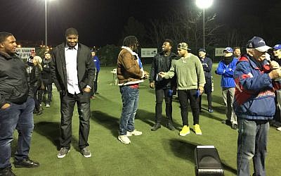The five NFL players who came to Israel visited briefly at Jerusalem's Kraft Stadium Saturday night, February 18, 2017. From left to right, they are Dan Williams, Calais Campbell, Cameron Jordan, Delanie Walker and Mychal Kendricks, with AFI founder Steve Leibowitz in the foreground (Jessica Steinberg/Times of Israel)