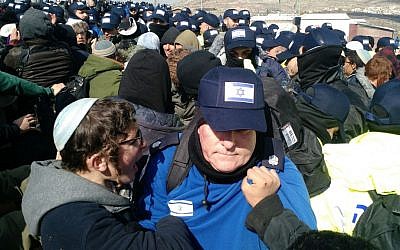 A protest shouts at a police officer during the evacuation of the illegal Amona outpost in the West Bank on February 1, 2017. (Hadas Parush/Flash90) A protest shouts at a police officer during the evacuation of the illegal Amona outpost in the West Bank on February 1, 2017. (Hadas Parush/Flash90)