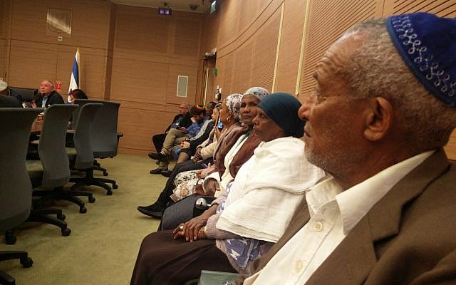 Ethiopian Israelis attend a Knesset committee meeting on the government's failure to implement a decision to bring 1,300 member of the Jewish community from Ethiopia to Israel, February 20, 2017. (Raoul Wootliff/Times of Israel)
