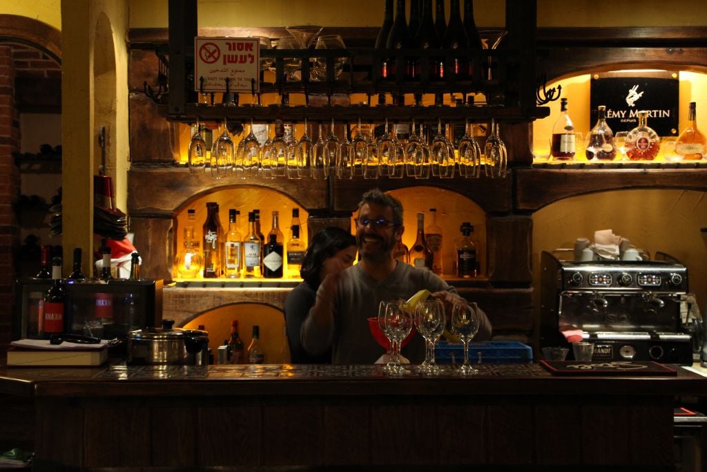 Serving drinks at the Venya Bar, one of the newer additions to the downtown Haifa scene (Courtesy Avi Shumacher)