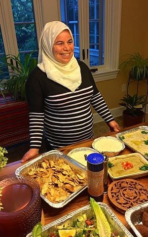 Maryam Al Radi with the spread she prepared for Syria Supper Club dinner in Maplewood, NJ, September 2016. (Courtesy)
