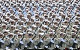 In this Sept. 21, 2016 file photo, Iranian armed forces members march in a military parade marking the 36th anniversary of Iraq's 1980 invasion of Iran, in front of the shrine of late revolutionary founder Ayatollah Khomeini, just outside Tehran, Iran. (AP Photo/Ebrahim Noroozi, File)