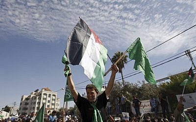 Hamas terrorist Nael Barghouti waves a green Islamic flag and a Palestinian flag to the crowd after arriving in the West Bank city of Ramallah. after he was released as part of an exchange for Gilad Shalit, an Israeli soldier held by Hamas, October 18, 2011. (AP Photo/Majdi Mohammed) Hamas terrorist Nael Barghouti waves a green Islamic flag and a Palestinian flag to the crowd after arriving in the West Bank city of Ramallah. after he was released as part of an exchange for Gilad Shalit, an Israeli soldier held by Hamas, October 18, 2011. (AP Photo/Majdi Mohammed)